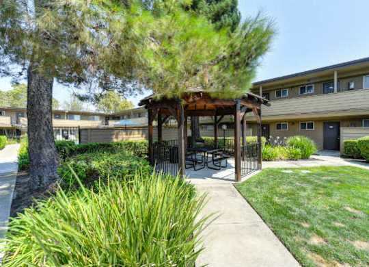 Outdoor Space with Gazebo with Grass, Walkways and Trees  at Olympus Park Apartments, Roseville, California