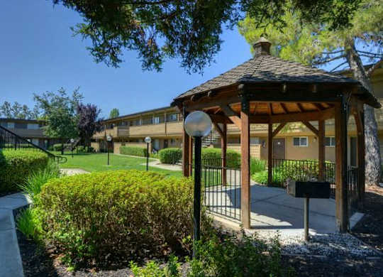 Outdoor Space with Gazebo, Grass and Tress  at Olympus Park Apartments, Roseville, California