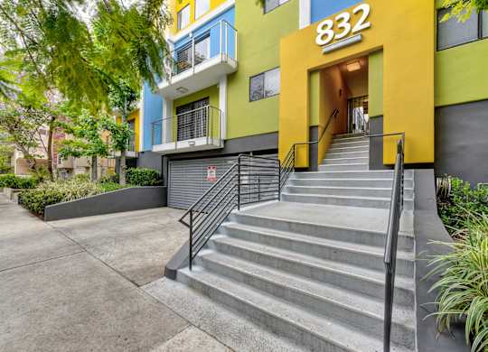 Stairway to the community entrance. At the top of the entrance are the numbers 832.at Croft Plaza Apartments, California, 90069