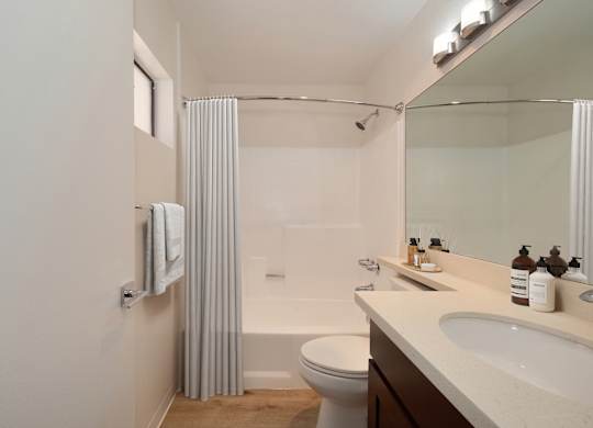 a bathroom with a shower toilet and sink at Croft Plaza Apartments, West Hollywood, 90069