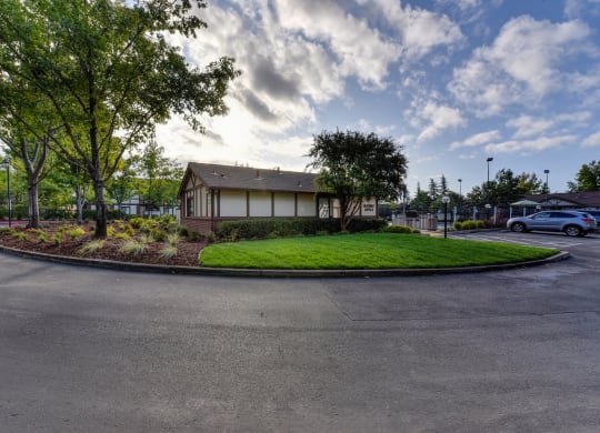Entrance Road with Road, Grass, Trees and Building Exterior at Rocklin Manor  Apartments, Rocklin  