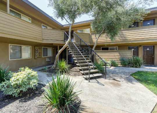 Exterior Walkways with Landscaping, Stairs, and Plants  at Olympus Park Apartments, Roseville, CA