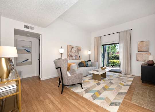 a living room with hardwood floors and a sliding glass door at Fountains of Fair Oaks, Fair Oaks, CA 95628