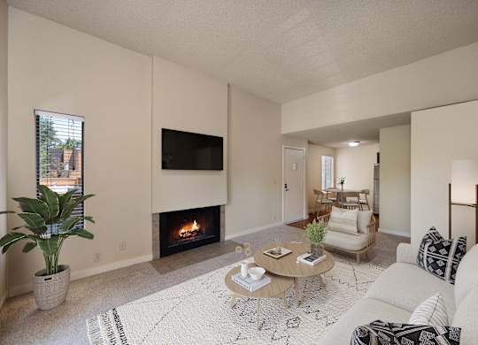 a living room with a fireplace and a couch at Fountains of Fair Oaks, California