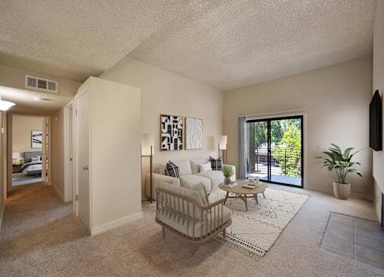 an open living room with a couch and a table at Fountains of Fair Oaks, California