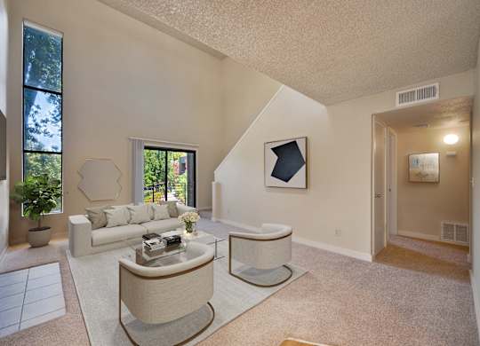 a living room with two couches and a coffee table at Fountains of Fair Oaks, California