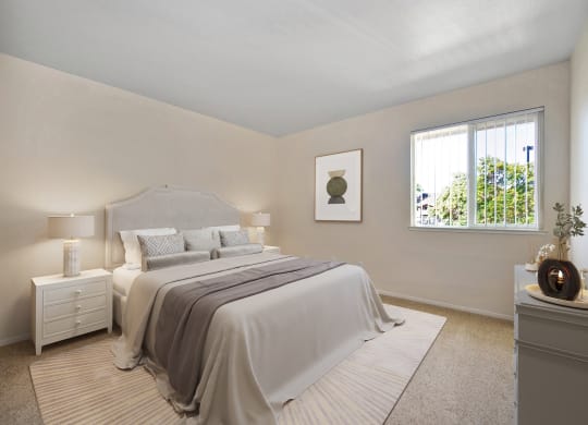 a bedroom with a bed and a window