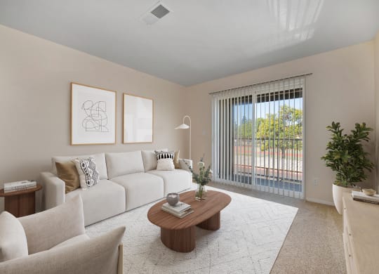 a living room with a white couch and a coffee table
