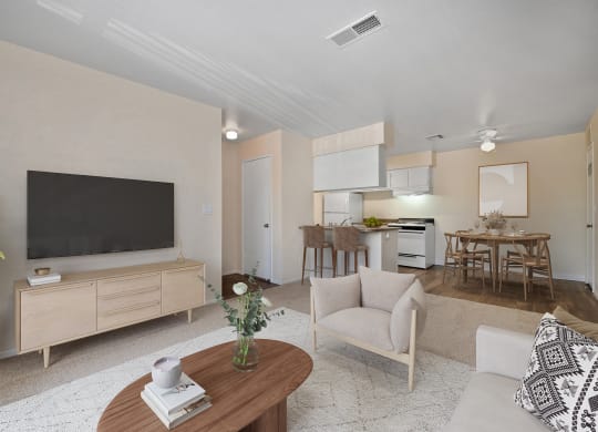 a living room with a tv and a table with a chair