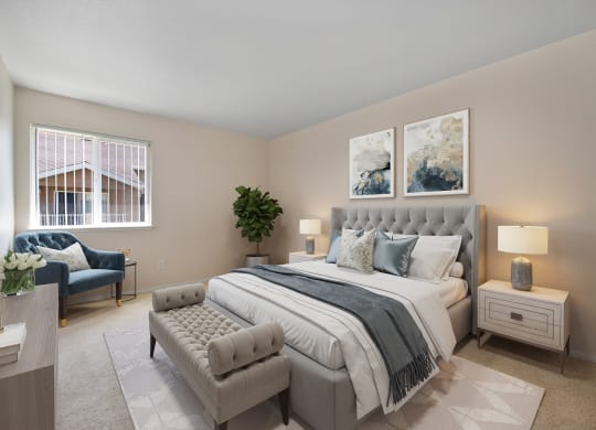 a bedroom with a bed and a chair and a window