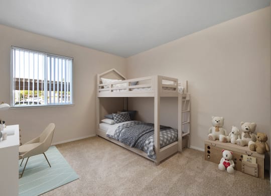 a bedroom with a bunk bed and a desk with teddy bears