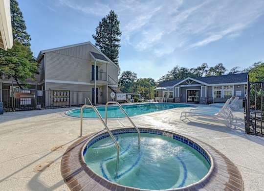 our apartments have a resort style pool with a hot tub at Hidden Oaks Apartments, Citrus Heights, California