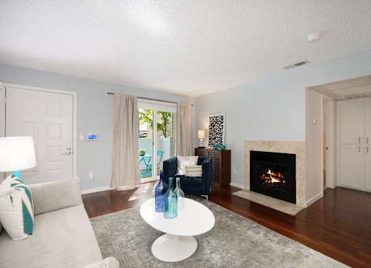 Spacious Living Room with Hardwood Flooring and Stylish Interior Showing Natural Light at Hidden Oaks Apartments, Citrus Heights, CA