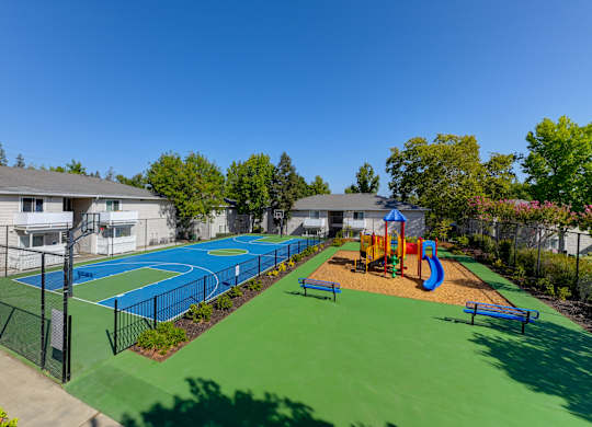 Basketball Court On-site with playground right next to it.at The Renaissance Apartments, California