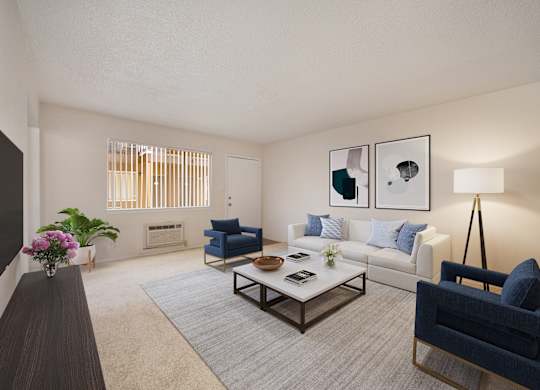 A living room with a blue chair and a coffee table.