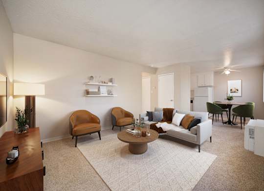 A living room with a couch, chairs, and a coffee table.
