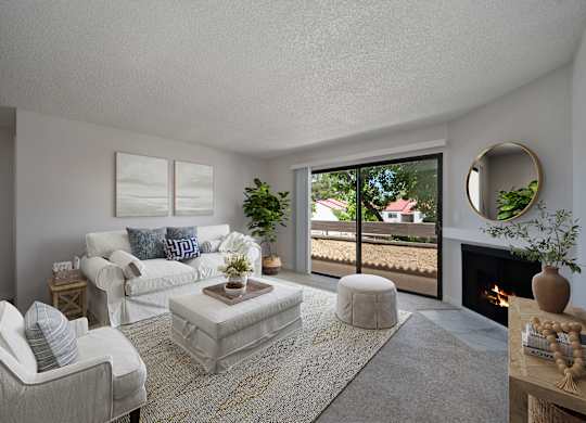 A living room with a fireplace and a view of a house through the window.