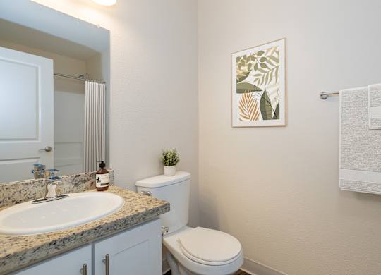 A Bathroom with a Toilet at Rocklin Manor Apartments, Rocklin, CA