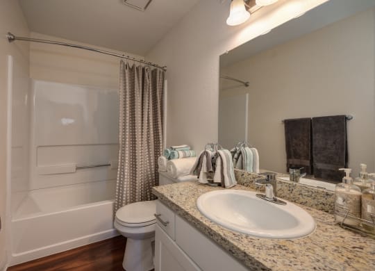Bathroom with Sink, Toilet, Hardwood Inspired Floor and Bathtub at Rocklin Manor  Apartments, Rocklin  ,California, 95677