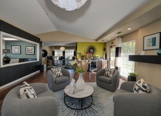 Rocklin manor Leasing office seating/lounge area with four cushioned swivel chairs at Rocklin Manor  Apartments, California