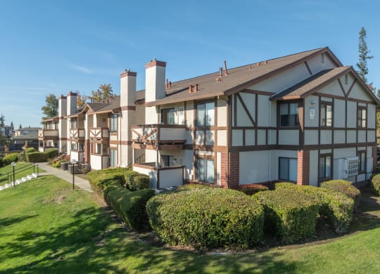 a view of a building with a yard in front of it at Rocklin Manor  Apartments, California, 95677