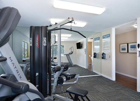 A Gym with a Rowing Machine at Rocklin Manor Apartments, California, 95677