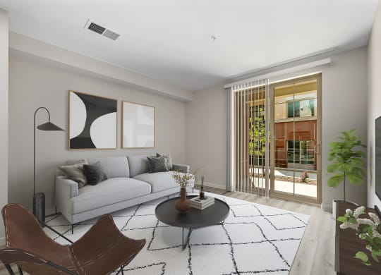 a living room with a white couch and a black coffee table
