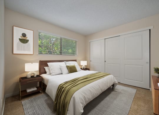 a bedroom with a large bed and a window at Silverstone Apartments, California