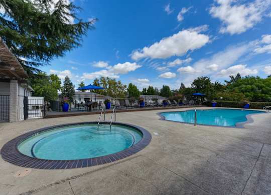 Outdoor Spa in circular shape.  Swimming pool in the distance.at The Renaissance Apartments, Citrus Heights, CA 95610