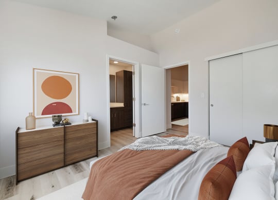 a bedroom with a bed and a closet and a bathroom  at Track 281 Apartments, Sacramento, 95811