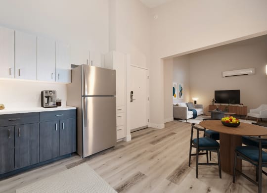 a kitchen and living room with stainless steel appliances and a wooden floor  at Track 281 Apartments, Sacramento, CA, 95811