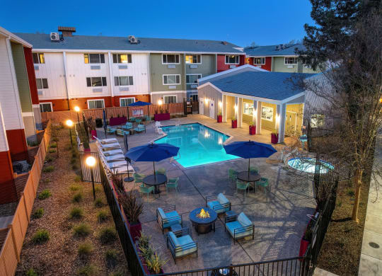 an aerial view of a swimming pool at night