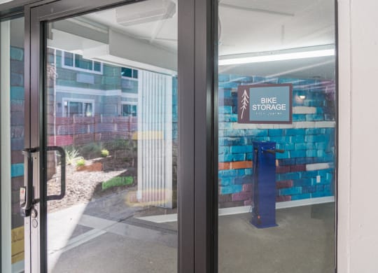 the entrance to the bike store with a sign in the door