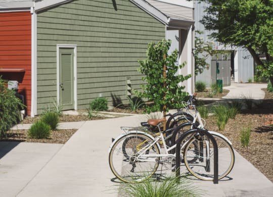 a group of bikes parked in front of a house