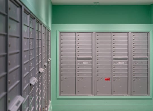 a row of lockers in a room with green walls
