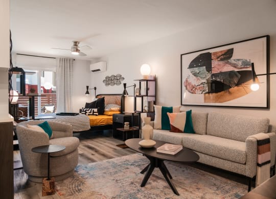 a living room with couches and chairs and a table