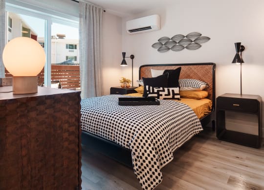 a bedroom with a bed and a ceiling fan