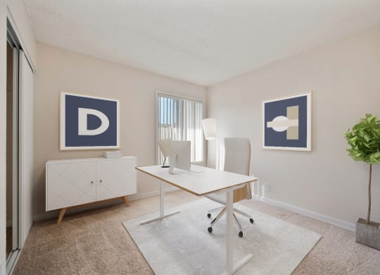 A spare bedroom used as an office  with a desk and a window at Vineyard Terrace Apartments, Napa, CA