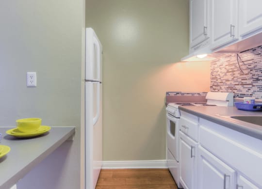 Fully equipped kitchen at Twenty 2 Eleven Apartment Homes, Canoga Park, CA