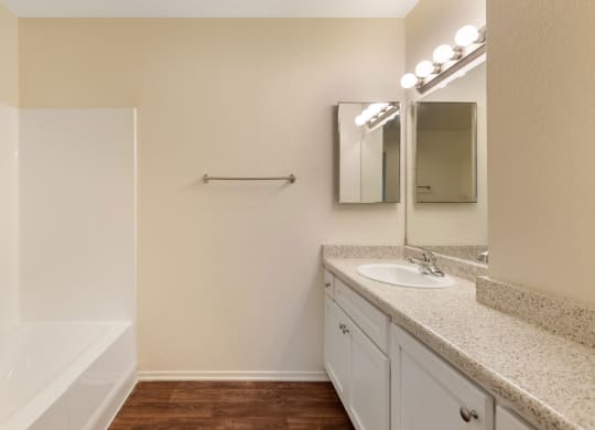 the preserve at ballantyne commons apartment bathroom with sink and mirror