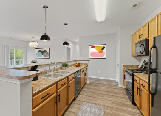 Kitchen with pendant lighting at Aspen Lakes Apartments, Indiana, 46217