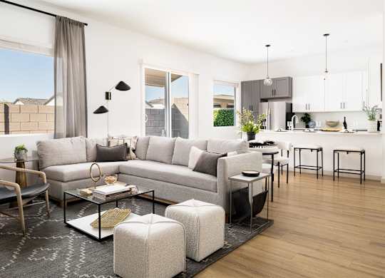 a rendering of a living room and kitchen in an apartment at Villas on Ash, Gilbert, AZ 85234