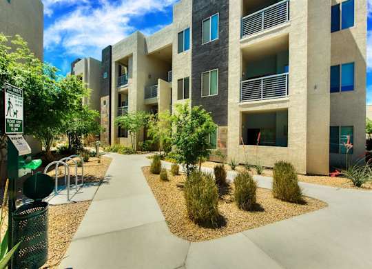 A modern apartment complex with a pedestrian  at Craft at Gilbert and Baseline Apartments, Mesa, Arizona