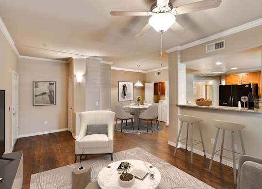 A modern living room with a white ceiling fan and a grey rug at Superstition Canyon Apartments, Mesa, 85209