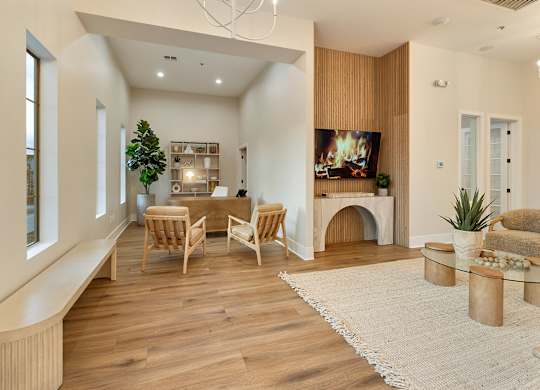 a living room with a fireplace and a table and chairs at Villas on Ash, Arizona, 85234