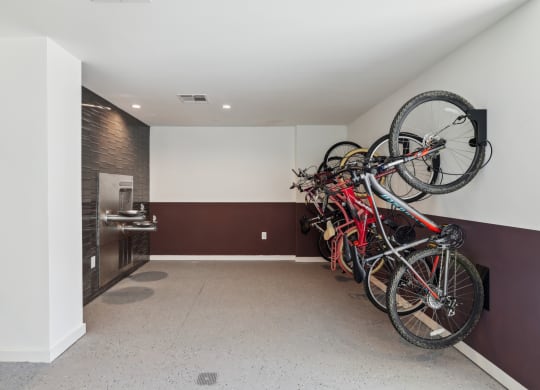 a group of bikes hanging on the wall in a room at Link Apartments® Broad Ave, Memphis, 38112