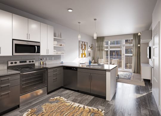 a kitchen with stainless steel appliances and a counter top at Link Apartments® Broad Ave, Memphis, 38112