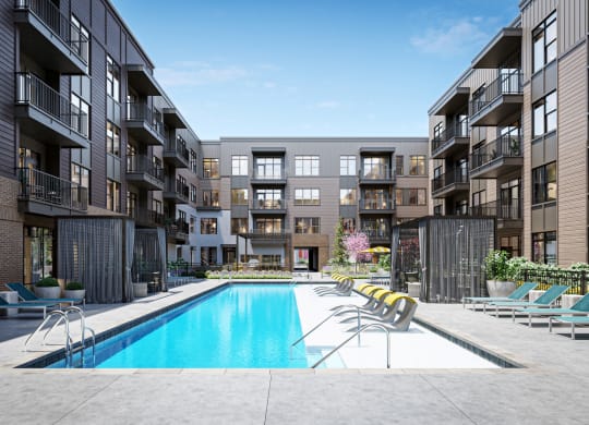 a swimming pool in the middle of an apartment building at Link Apartments® Broad Ave, Memphis