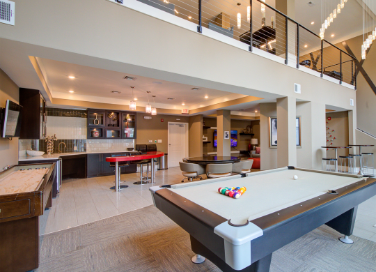 pool table in the clubhouse at the callaway house austin  at Link Apartments® Brookstown, Winston Salem