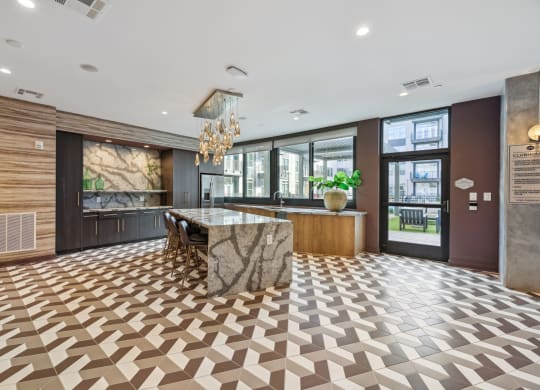 the lobby of a hotel with a marble bar and a checkered floor at Link Apartments® Broad Ave, Memphis, Tennessee